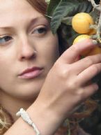 http://curezone.com/upload/Blogs/Your_Enchanted_Gardener/tn-Abagail_Reed_with_Loquat_Tree.jpg